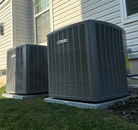 Arctic Fire technician performing AC maintenance on central air system